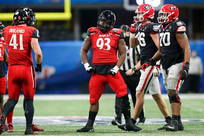 Jan 1, 2021; Atlanta, GA, USA; Cincinnati Bearcats defensive tackle Elijah Ponder (93) reacts after a tackle against the Georgia Bulldogs in the first quarter of the Chick-fil-A Peach Bowl at Mercedes-Benz Stadium. Mandatory Credit: Brett Davis-USA TODAY Sports